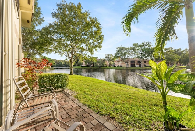 view of patio with a water view