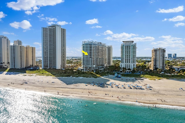 exterior space featuring a water view and a view of the beach