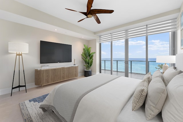 bedroom featuring ceiling fan, multiple windows, and access to outside