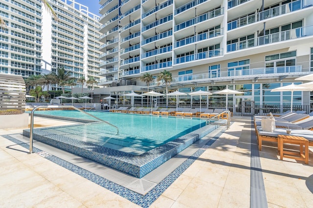 view of swimming pool featuring a patio