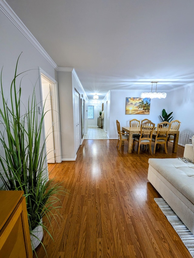 interior space featuring crown molding and hardwood / wood-style floors