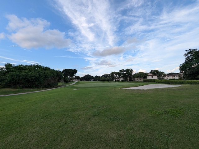 view of property's community with a yard