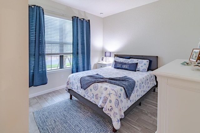 bedroom with light hardwood / wood-style floors