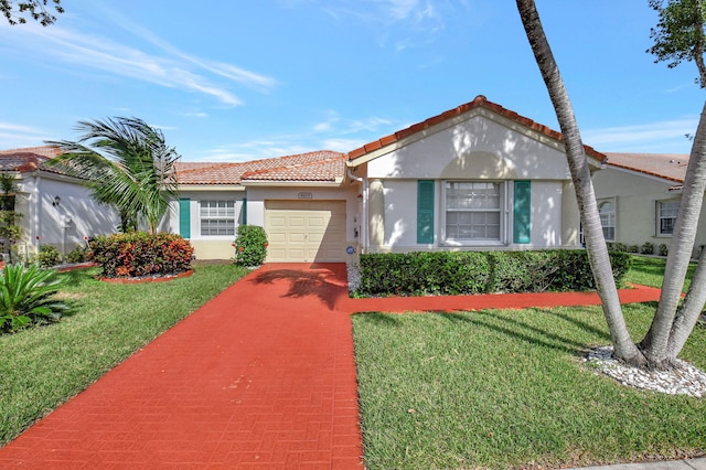 mediterranean / spanish-style house featuring a front lawn and a garage