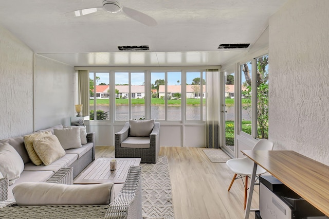 sunroom / solarium featuring a healthy amount of sunlight