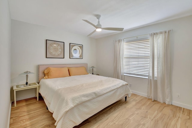 bedroom featuring ceiling fan and light hardwood / wood-style flooring