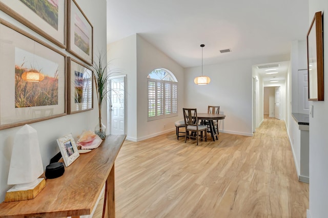 dining space with light hardwood / wood-style floors