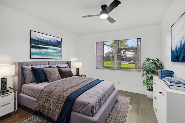 bedroom featuring ceiling fan and dark hardwood / wood-style floors