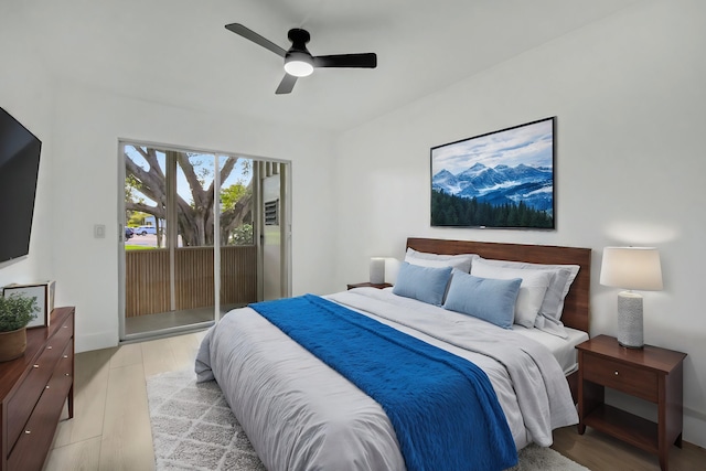 bedroom featuring ceiling fan, light hardwood / wood-style floors, and access to exterior