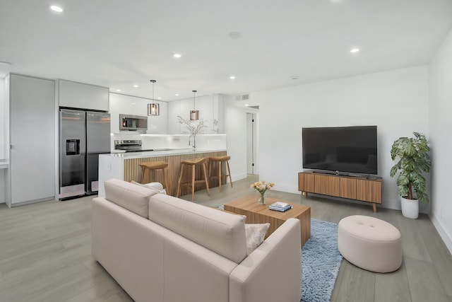 living room featuring light wood-type flooring