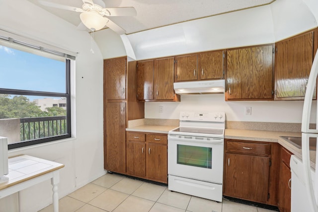 kitchen with ceiling fan, white range with electric stovetop, and light tile patterned floors