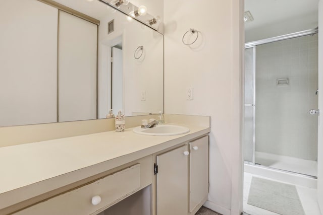 bathroom with vanity and walk in shower