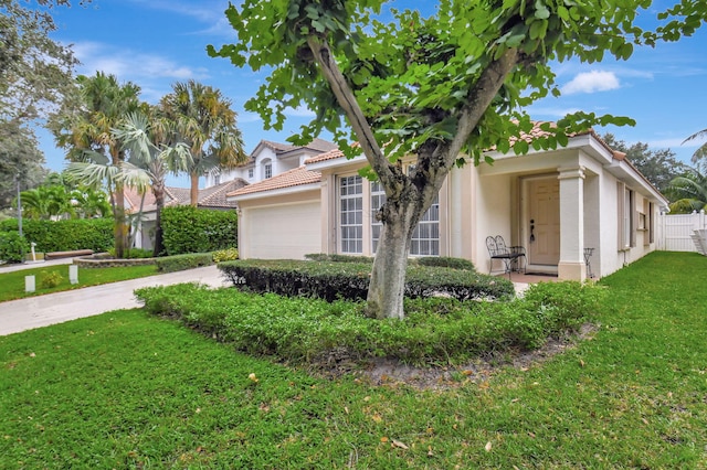 view of home's exterior featuring a lawn and a garage