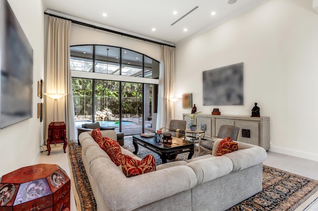 living room featuring a high ceiling