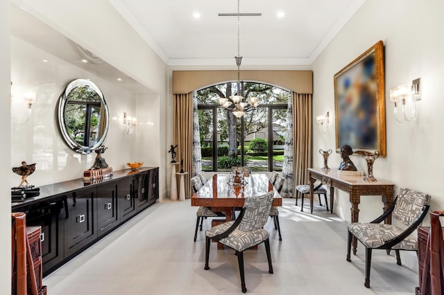 dining area with a chandelier and crown molding