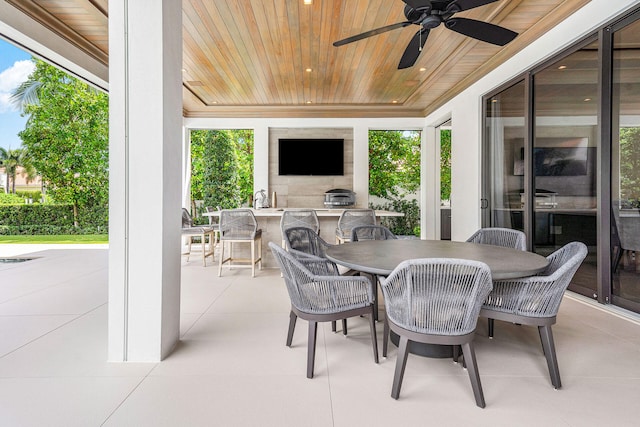 view of patio featuring area for grilling, ceiling fan, and sink