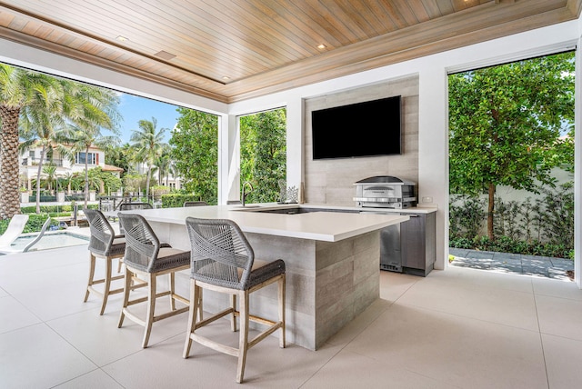 view of patio / terrace with area for grilling and exterior bar