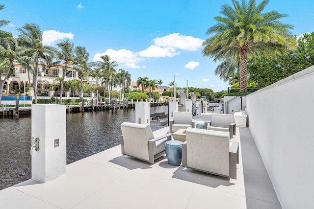 view of patio / terrace featuring a boat dock and a water view