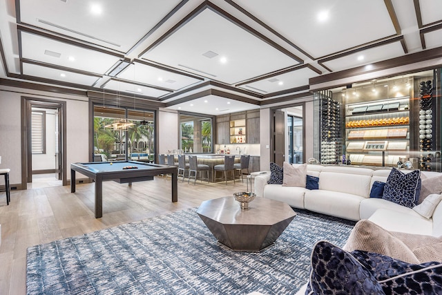 playroom with light hardwood / wood-style floors, beam ceiling, pool table, and coffered ceiling