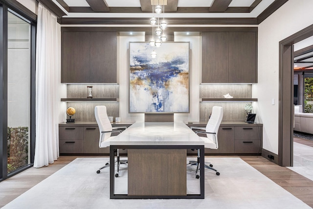 home office featuring beam ceiling, light hardwood / wood-style flooring, crown molding, and coffered ceiling