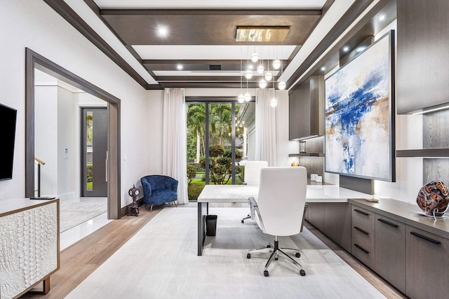 office space featuring crown molding and light hardwood / wood-style floors