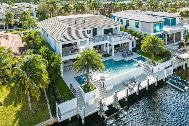 birds eye view of property with a water view