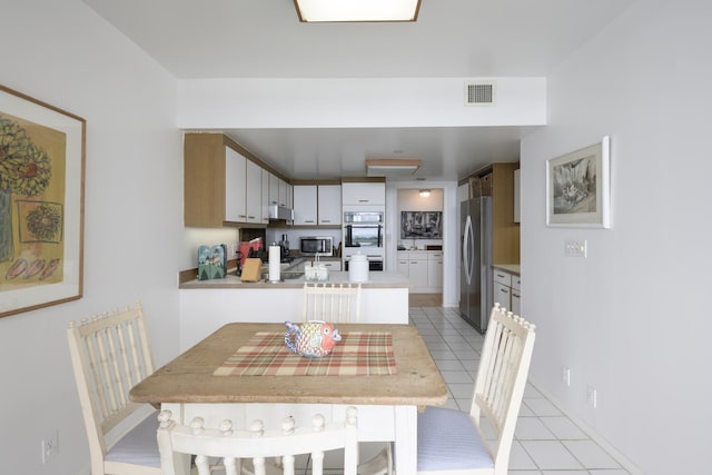 view of tiled dining area