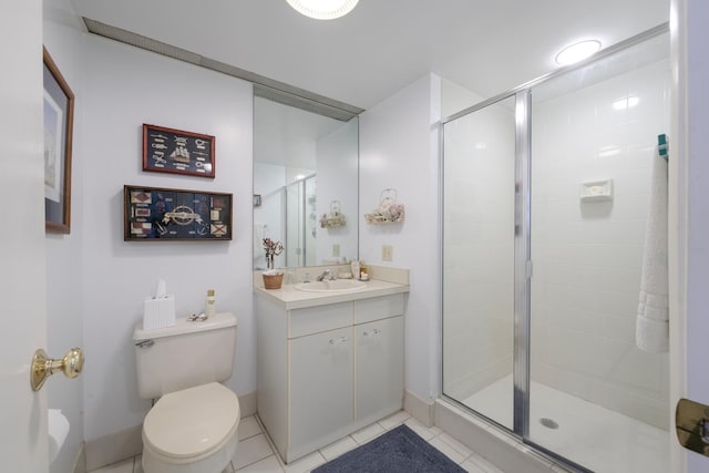 bathroom featuring tile patterned floors, vanity, walk in shower, and toilet