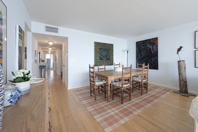 dining space featuring light hardwood / wood-style flooring