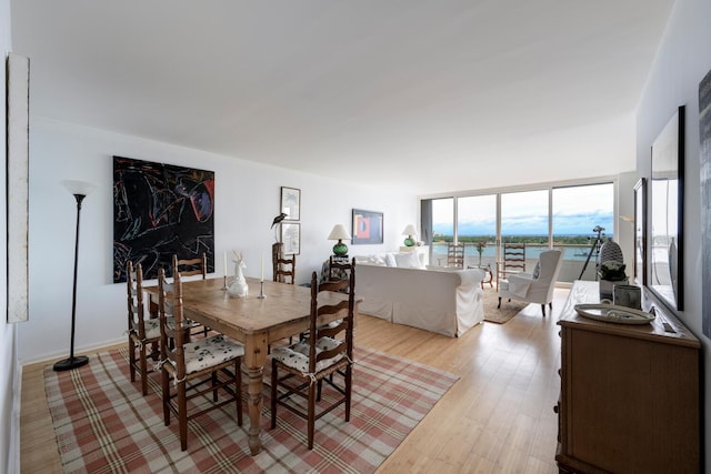 dining space featuring light wood-type flooring