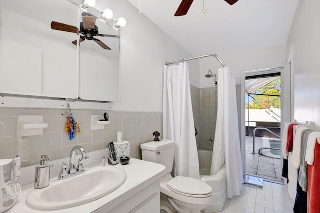 full bathroom featuring vanity, tile patterned floors, toilet, tile walls, and shower / tub combo