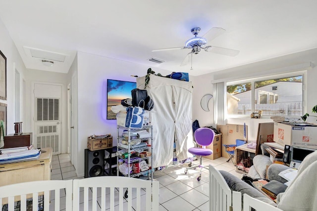 tiled bedroom with ceiling fan