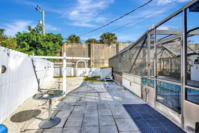 view of patio / terrace with glass enclosure