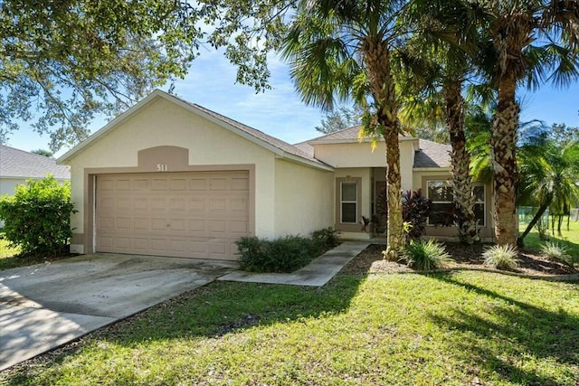 view of front of home with a front lawn and a garage