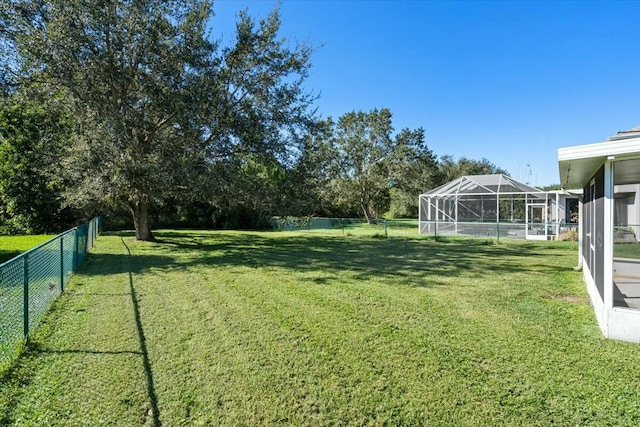 view of yard featuring a lanai