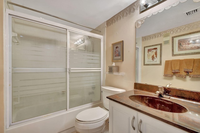 full bath featuring enclosed tub / shower combo, visible vents, toilet, and vanity