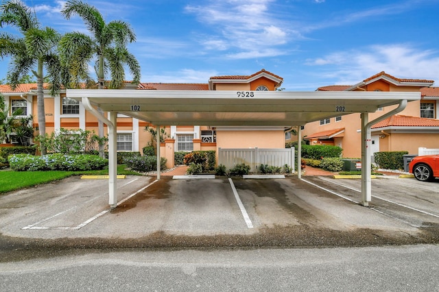 view of partially covered parking lot