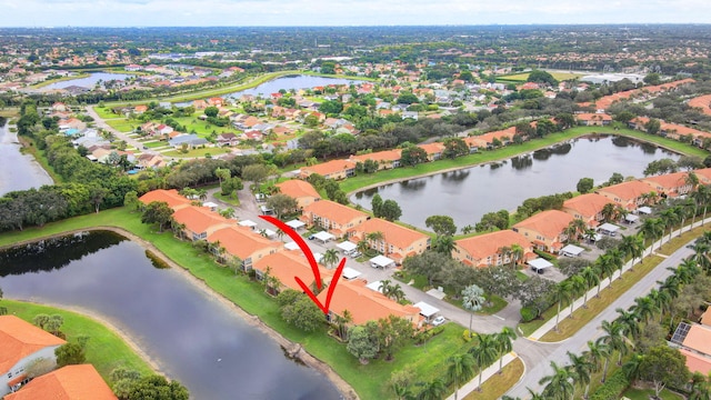 bird's eye view with a water view and a residential view