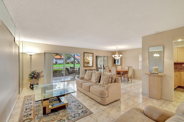 tiled living room with a textured ceiling and an inviting chandelier