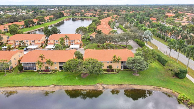 bird's eye view featuring a water view and a residential view