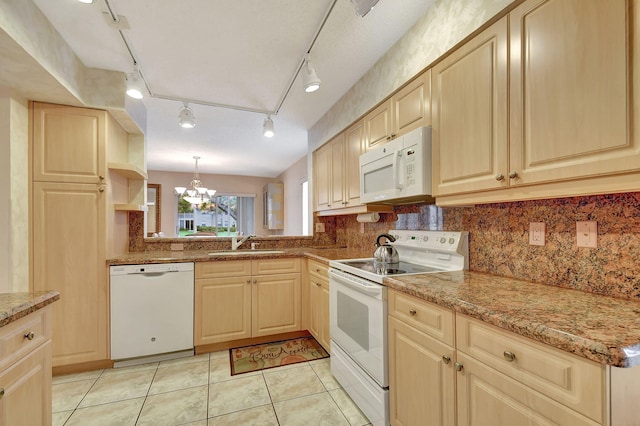 kitchen featuring a sink, white appliances, an inviting chandelier, and light brown cabinets