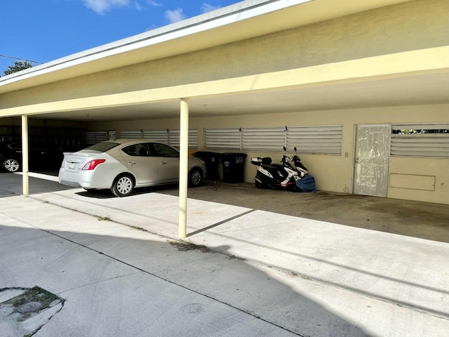 view of vehicle parking featuring a carport