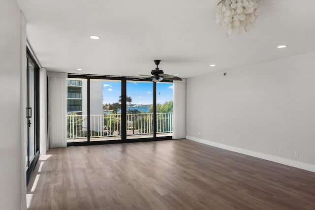 3400 S Ocean Blvd Unit 3Fii, Palm Beach, FL 33480 - spare room with floor to ceiling windows, wood finished floors, a ceiling fan, and recessed lighting