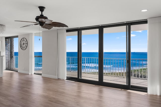 3400 S Ocean Blvd Unit 3Fii, Palm Beach, FL 33480 - empty room with expansive windows, ceiling fan, wood finished floors, healthy amount of natural light, and recessed lighting