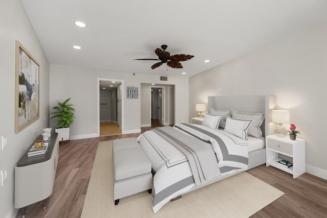 bedroom featuring hardwood / wood-style floors and ceiling fan