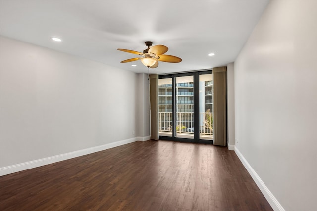 3400 S Ocean Blvd Unit 3Fii, Palm Beach, FL 33480 - spare room featuring ceiling fan, a wall of windows, dark wood-type flooring, and recessed lighting