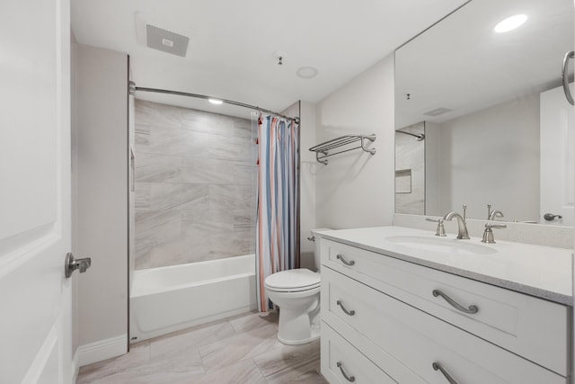 full bathroom featuring vanity, shower / bath combination with curtain, and toilet