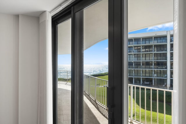 balcony featuring a water view