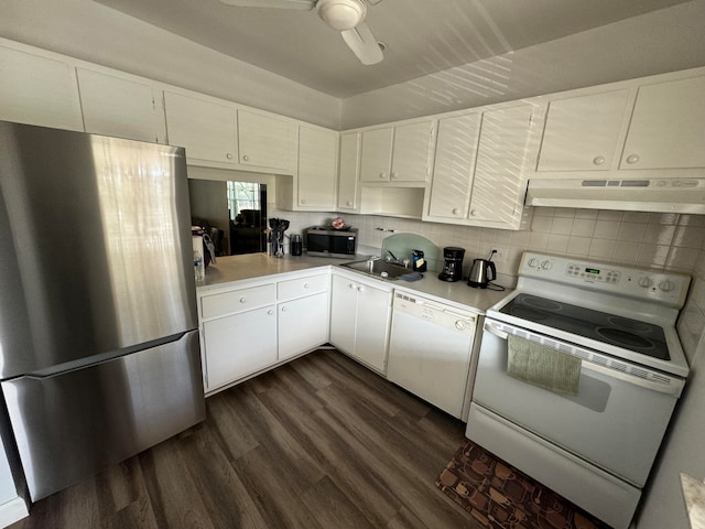 kitchen with white cabinets, dark hardwood / wood-style floors, stainless steel appliances, and exhaust hood