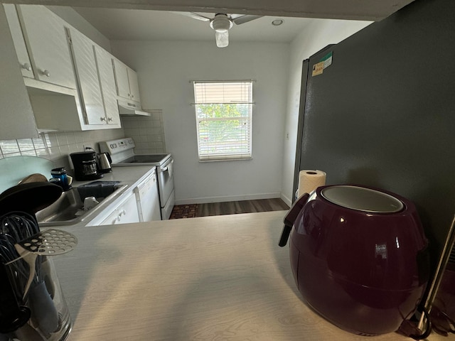 kitchen featuring white cabinets, white electric range, decorative backsplash, ceiling fan, and wood-type flooring